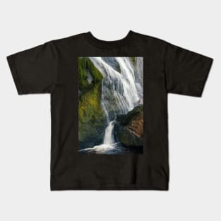 A beautiful waterfall cascades down a mountain in Ireland. Kids T-Shirt